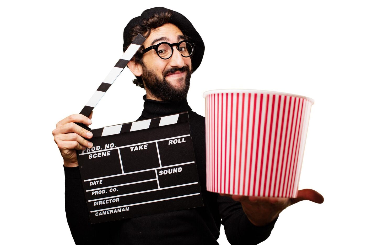 A man holding a clapperboard and a striped popcorn bucket, dressed as a film director
